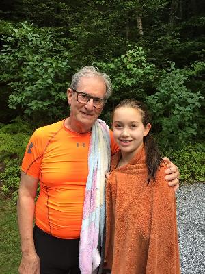 My grandfather and me after our first swim to the island in 2016.